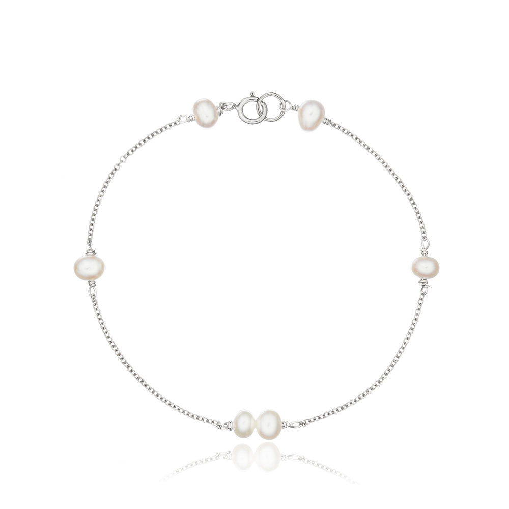 Silver six pearl bracelet on a white background